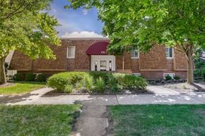 Delaware apartment for rent - A red brick house with a white door and windows.