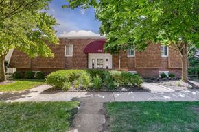 Delaware apartment for rent - A red brick building with a white door and windows.