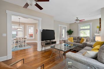 Columbus apartment for rent - A living room with a grey couch and a glass coffee table.