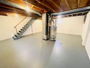 Delaware apartment for rent - an empty garage with a staircase in the background