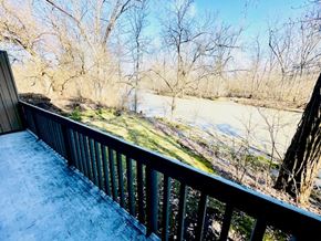 Delaware apartment for rent - a balcony with a view of a river and trees
