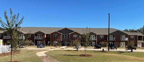 Milledgeville apartment for rent - an apartment building with a yard in front of it
