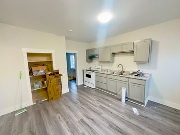 Stellarton apartment for rent - a kitchen is being remodeled with white cabinets and wood floors