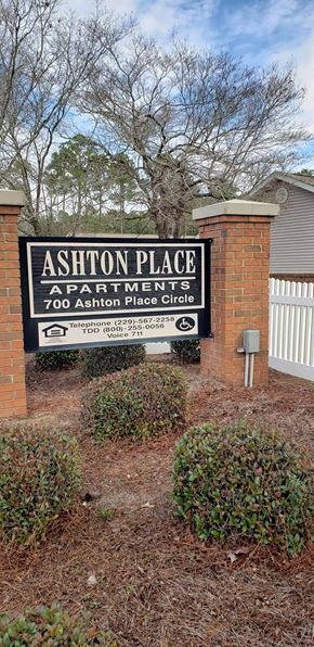 Ashburn apartment for rent - a sign apartments in front of a brick building