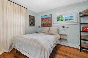 Santa Monica house for rent - a bedroom with a bed and a window with a white curtain