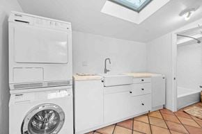 Santa Monica house for rent - a white laundry room with a washing machine and a sink