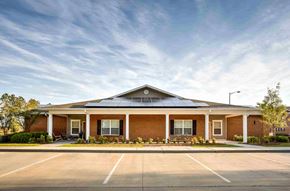 Hahira apartment for rent - the front of a brick building with a parking lot