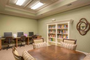 Hahira apartment for rent - a conference room with a table and chairs and a library