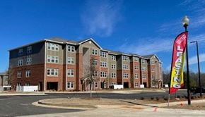 Columbus apartment for rent - a building with a flag in front of it