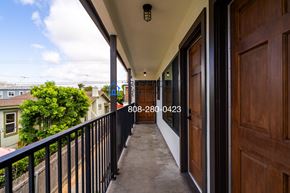 San Diego apartment for rent - a balcony with a view of the street and a wooden door