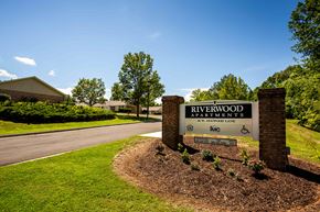 Blue Ridge apartment for rent - the sign for riverwood apartments in front of the street