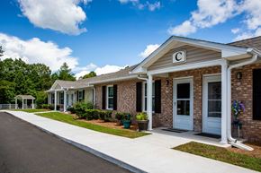 Blue Ridge apartment for rent - the front of a brick building with a porch and a sidewalk