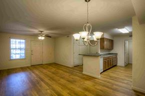 Lake Park apartment for rent - an empty kitchen and living room with a kitchen island and a window
