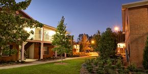 Lake Park apartment for rent - a city street with houses and trees at night