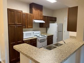 Albany apartment for rent - a kitchen with a granite counter top and white appliances