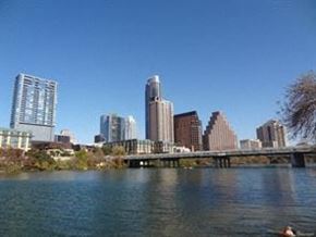 Austin apartment for rent - a body of water with a city skyline in the background