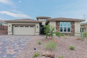 Marana house for rent - a house with a driveway and a garage door