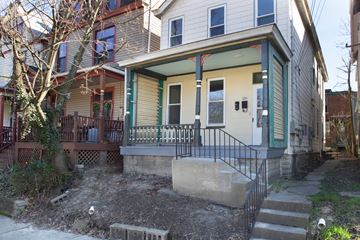 Pittsburgh apartment for rent - the front of a house with stairs and a wheelchair ramp