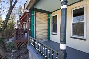 Pittsburgh apartment for rent - the front porch of a house with a wooden railing