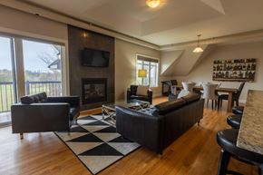 Stittsville apartment for rent - A living room with a fireplace and a television.