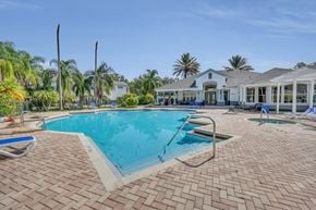 Orlando apartment for rent - a large swimming pool with a house in the background
