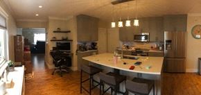 Victoria apartment for rent - a kitchen with a bar and a counter top