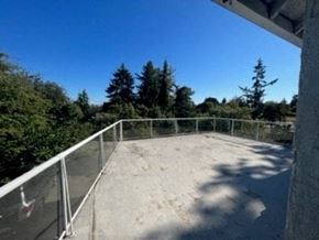 Victoria apartment for rent - a balcony with a railing and trees in the background