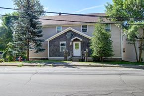 Pictou apartment for rent - a house with a white door and a street in front of it