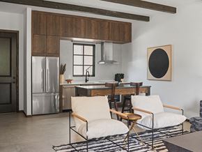Oklahoma City apartment for rent - A modern kitchen with a wooden cabinet and a fridge.