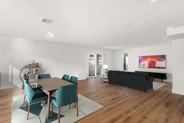 Los Angeles apartment for rent - a living room with a dining room table and a couch