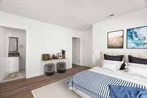 Los Angeles apartment for rent - a bedroom with white walls and a bed with blue and white sheets