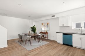 Los Angeles apartment for rent - a dining room with a table and chairs and a kitchen with a sink