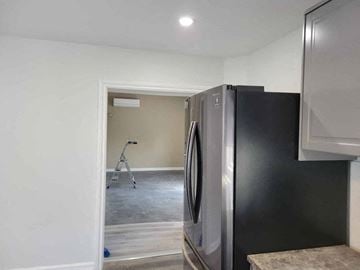 Westville apartment for rent - a kitchen with a refrigerator and a door open