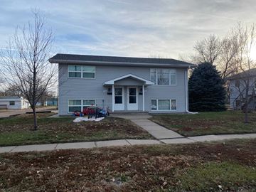 Kearney apartment for rent - a blue house with a sidewalk in front of it