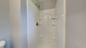 Clarksville house for rent - a white bathroom with a shower and a sink