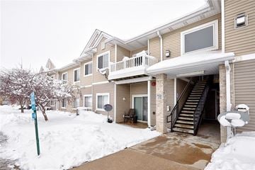 Waukee apartment for rent - a row of homes covered in snow