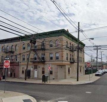 Newark apartment for rent - an old building on the corner of a city street