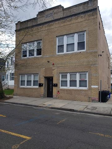 East Orange apartment for rent - the front of a brick building with a black door