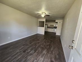 Hearne apartment for rent - A room with wooden flooring and a ceiling fan.