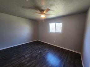 Hearne apartment for rent - A room with a ceiling fan and a window.