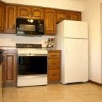 Arden Hills apartment for rent - a kitchen with a stove refrigerator and microwave