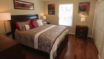 Nashville house for rent - the master bedroom has a king size bed and hard wood floors