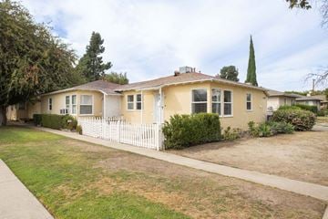 Burbank apartment for rent - A house with a white picket fence in front.