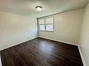 Washington apartment for rent - an empty room with hardwood floors and a window