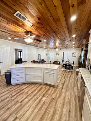 Lafayette house for rent - a kitchen with a center island and a dining room