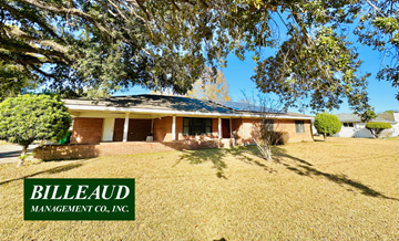 Lafayette house for rent - a small brick house with a tree in front of it