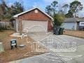 Pensacola house for rent - a house with graffiti on it in front of a driveway
