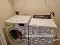Pensacola house for rent - a washing machine in a small room with a window