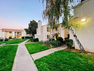 Lodi apartment for rent - a sidewalk in front of a house with green grass