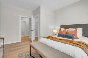 Boylston apartment for rent - a bedroom with a large bed and a couch